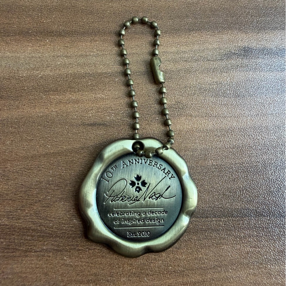 Patricia Nash 10th Anniversary Commemorative Medallion Hang Tag - Bronze